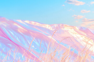 A serene landscape of shimmering hills in pastel hues under a clear blue sky, accented by gentle grass swaying in the breeze.