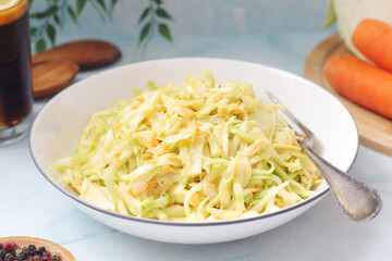 A bowl with coleslow salad	