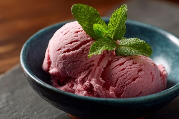Bowl of Pink Ice Cream Garnished with Fresh Mint Sprig