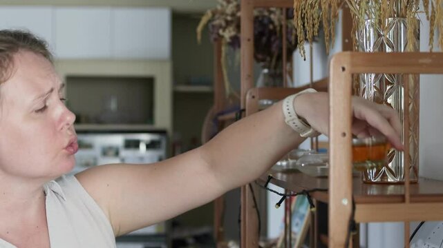 Portrait of singing woman cleaning apartment.