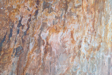 Orange old peeling rusty concrete slab. Background for design.