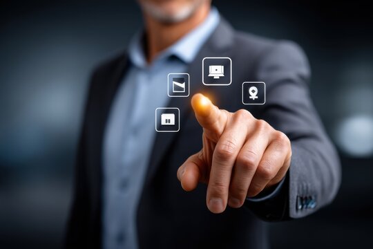Businessman touching virtual interface with various icons on a touch screen interface, concept of modern communication technology in business management. - Powered by Adobe