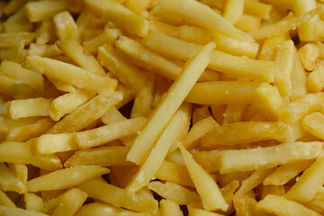 Fast food. Golden french fries background.