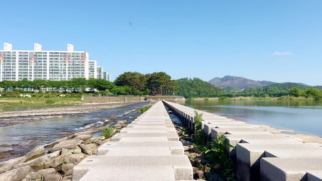a stepping-stone bridge across a stream. Miryang City, Korea
