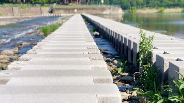 a stepping-stone bridge across a stream. Miryang City, Korea
