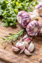 Close-up Garlic Cloves and Bulbs with rosemary salt and pepper