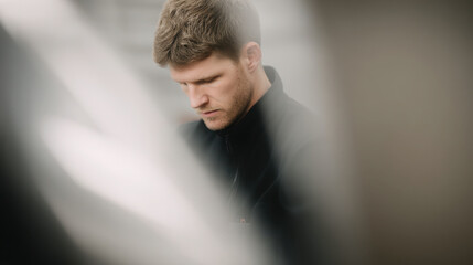 portrait of technician focused on his work positioned on left side of frame