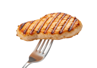 Grilled chicken breast on a fork. Delicious and healthy meal.