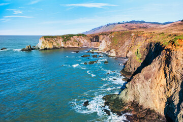 Coastal cliffs along California's Highway 1 in Northern California. Rugged ocean rocks, crashing...