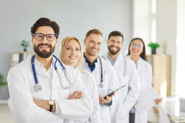 Fototapeta premium Medical confident successful team of doctors corporate group portrait, collaborative healthcare, nurses, pharmacists, therapists, administrative hr staff contributing to patient care system posing