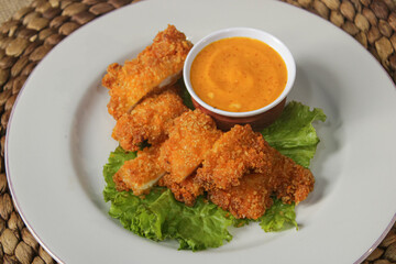 Delicious crispy chicken with cheese sauce