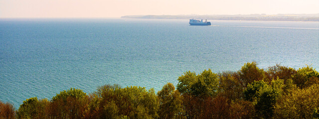 a ferry on the baltic sea coast of germany panorama near travemünde