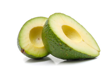 Two green avocados are cut in half and placed on a white background