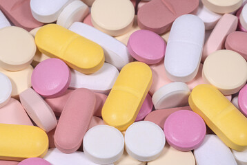 Multicolored medical pills close up