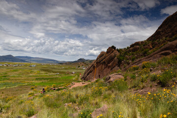 Reddish rock formations in Aramu Muru near Puno in Peru