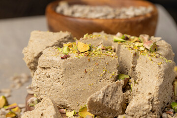 halva from sunflower seeds and crushed into one solid mass, a sweet delicious dessert made from fried sunflower with pistachios