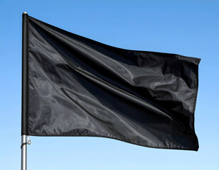 Black Flag Waving Against Blue Sky