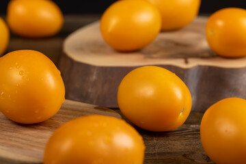 wet tomatoes on the table, freshly tomatoes with drops of water on them