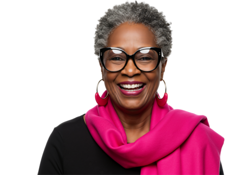 Portrait of an elderly African American woman with short gray hair, wearing oversized glasses and a vibrant pink scarf. She radiates joy and confidence against a black background.