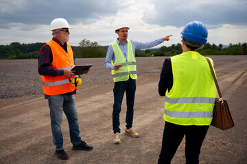 Highway engineers discuss and plan.