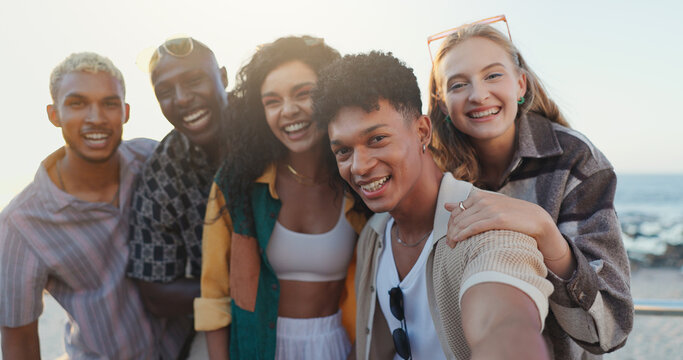 Friends, people and happy with selfie at beach for social media, travel memory and profile picture update. Diversity, group or photography on weekend adventure with laughing, support or internet post