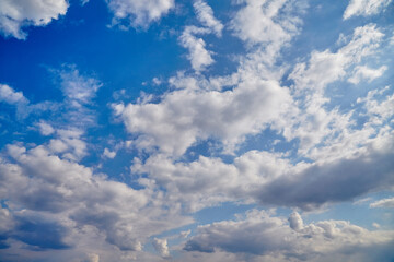 A wide-angle view of the sky with dominant Cumulus clouds creates a sense of infinity. It is suitable for web page design, background images, and presentations on ecology.