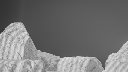 Bottle of perfume is shown on a rocky surface. The bottle is black and has a black cap. The bottle is placed on a rock, and the rock is surrounded by other mossy rocks. Premium photo 3d render.