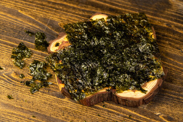 natural green algae that are used to prepare Japanese dishes, algae on a larch board