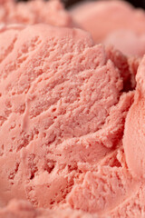raspberry ice cream in a glass, sweet frozen red ice cream with raspberry flavor closeup