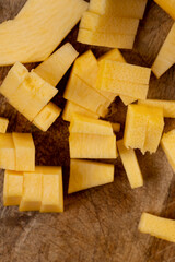 cut orange pumpkin closeup, orange pumpkin fruit details cut into pieces for cooking, side view