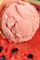 watermelon ice cream and red ripe watermelon, a waffle cup with watermelon-flavored ice cream and red fresh watermelon, closeup