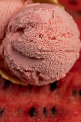 ice cream and ripe watermelon, a waffle cup with watermelon-flavored ice cream and red fresh watermelon, close up