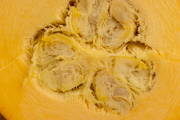 orange pumpkin on the table, orange pumpkin fruit details cut into pieces for cooking, side view