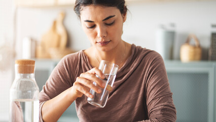 Looking at a glass of water with suspicion