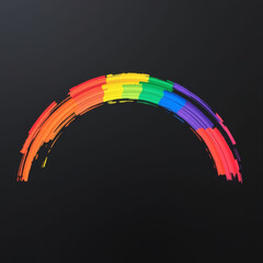 A vibrant rainbow painted on a black canvas, celebrating pride colors
