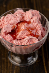 cold ice cream with berry flavor and smell, natural ice cream with strawberry flavor and fresh strawberry jam