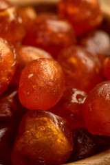 Obraz premium boiled with sugar syrup candied fruits of small fruits of kumquat, close up, side view
