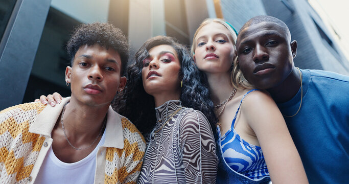Portrait, fashion and people in city, below and gen z with confidence, urban town and trendy clothes. Face, student group and friends in street, stylish outfit and bonding with low angle or diversity