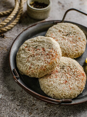 frozen fish cutlets on a metal tray