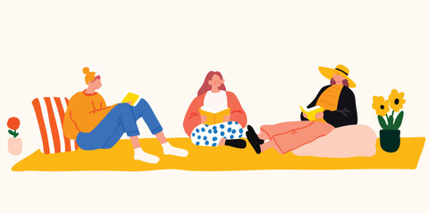 Three friends happily relaxing and reading books together on a yellow mat outdoors.&nbsp;