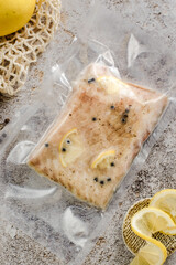 cod fillet with lemon in a package 