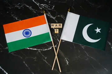 Flags of India and Pakistan and the inscription: War.