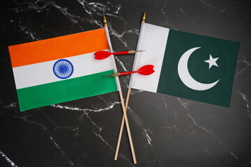 Flags of India and Pakistan and darts between them.