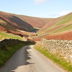 Naklejka premium Scenic Countryside Road Winding Through Rolling Hills and Stone Walls A tranquil Autumnal landscape