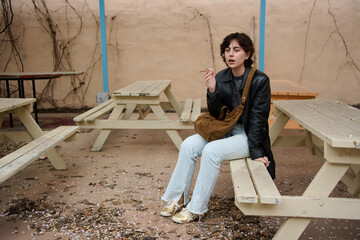 young woman sitting on a bench