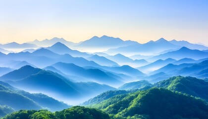 Fototapeta premium Serene sunrise over misty, layered blue mountains