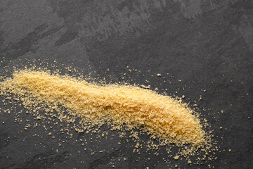 Yellow panko scattered in a pile - Fresh panko crumbs