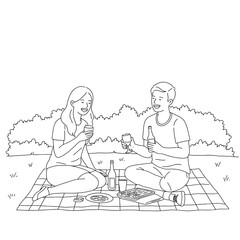 Couple enjoying a picnic and laughing in a sunny park  