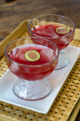 Red fruit punch drink in glass