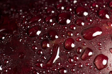 one wet ripe purple eggplant covered with drops of water , ripe eggplant on the table before cooking